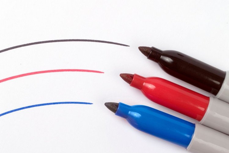 three sharpie markers with blue, red and black