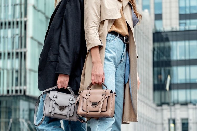 two womaen wear jeans on street