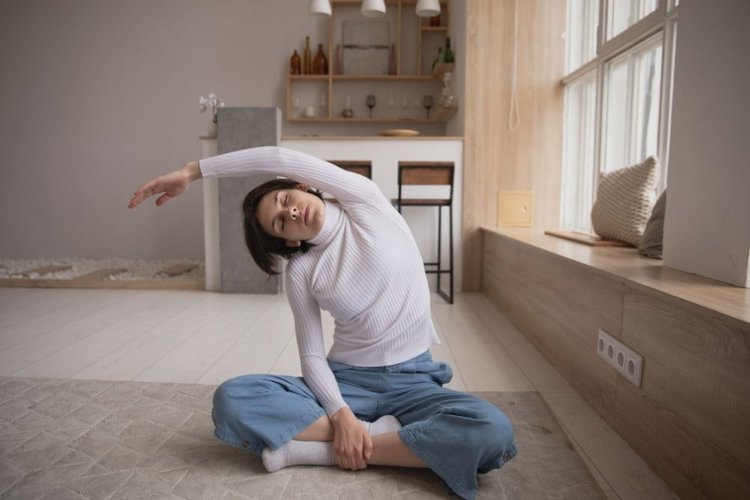 women waer jeans while doing yoga