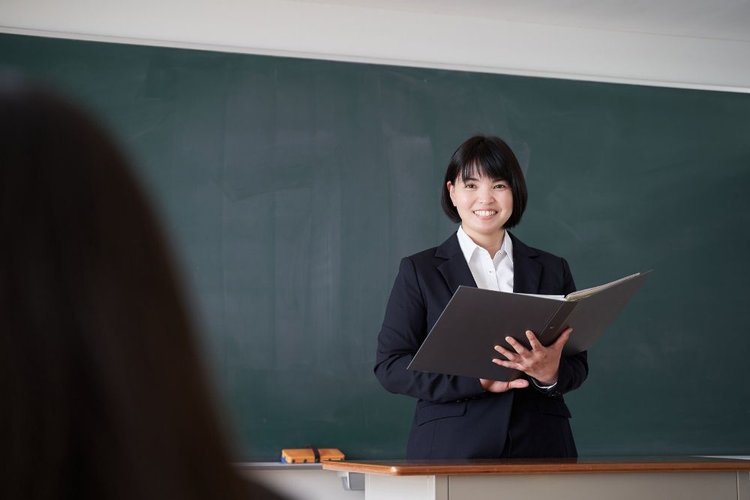 female teacher wearing suit for teaching in class