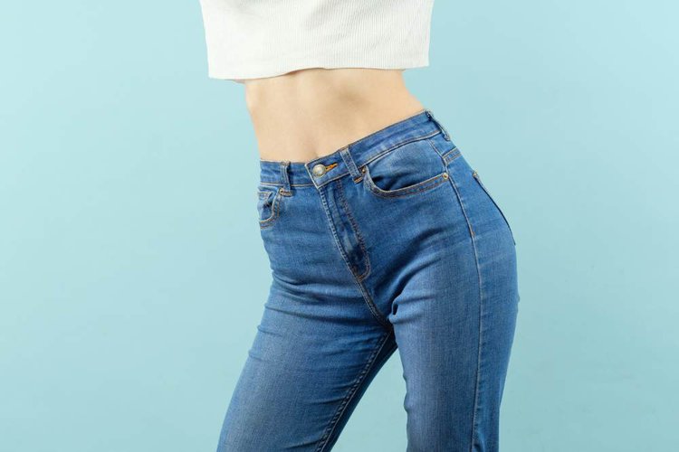 high-waisted jeans and crop top