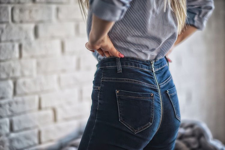 a girl with jeans fitting her body