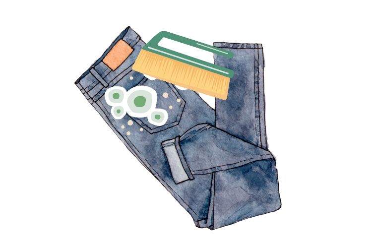 use a brush to clean loose mold on jeans