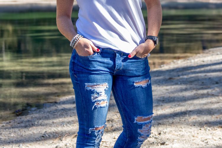 woman with ripped jeans