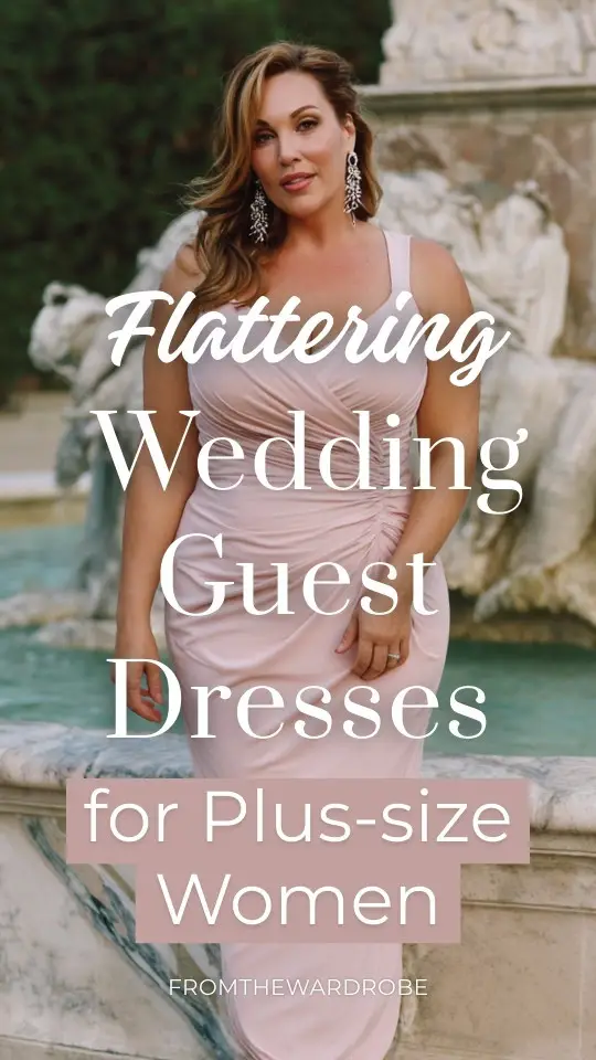 A plus-size woman over 40 wears a blush pink floor-length wedding guest dress with a draped neckline and side pleating for a slimming effect