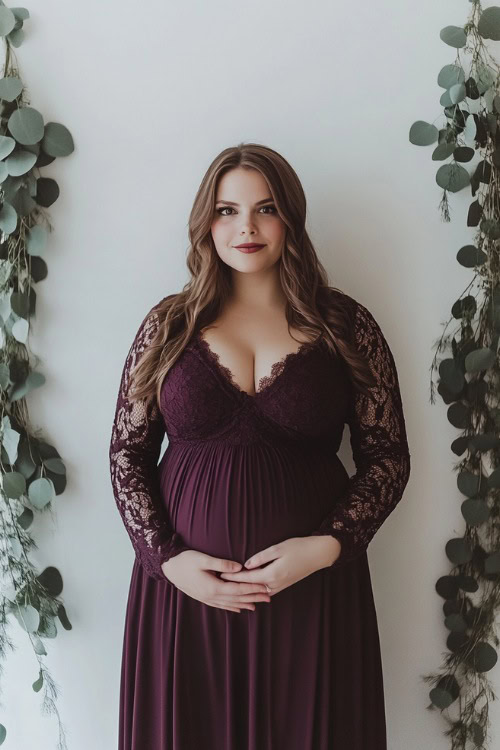 A woman in a plum-colored maxi dress with long lace sleeves and an empire waist