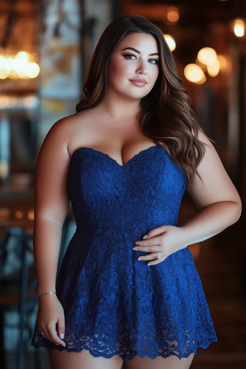 A fashionable plus-size woman in a cobalt blue sleeveless short dress with a sweetheart neckline, a tulip hemline, and floral lace detailing