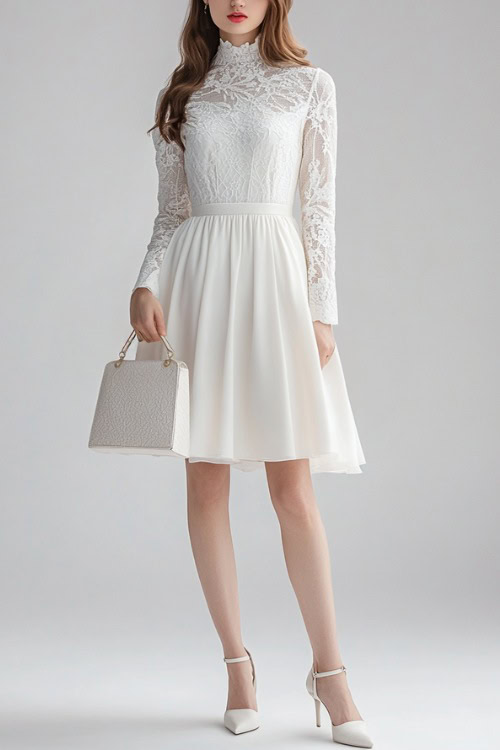 A woman in a white long-sleeve midi dress with lace details, accessorized with a structured handbag and heels