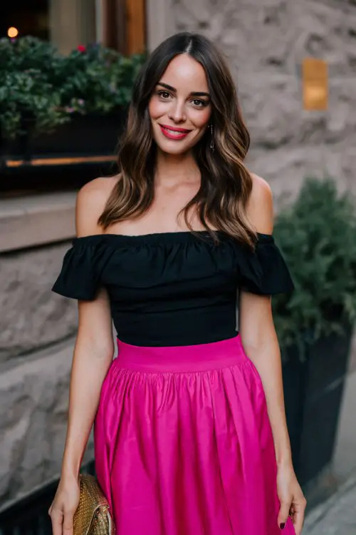 a woman wears a black off shoulder top with fuchsia pink midi skirt for a date night