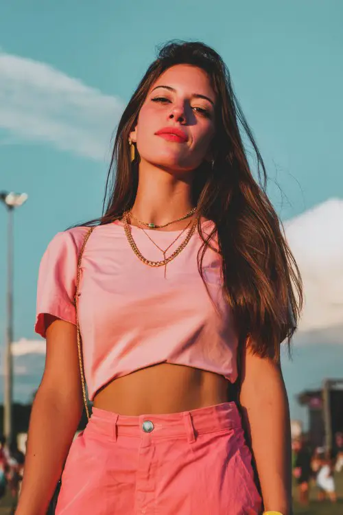 woman wear pink outfit at concert, outdoor, cute vibe