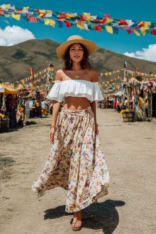 woman wearing off shoulder white ruffle crop top and flowy floral midi skirt, straw hat, sandals