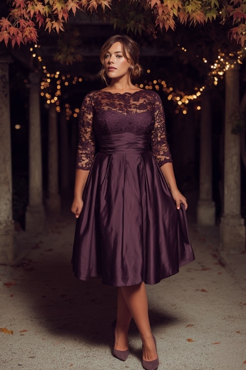 Elegant plus-size woman in a dark plum A-line wedding guest dress with lace overlay, three-quarter sleeves, and satin pumps