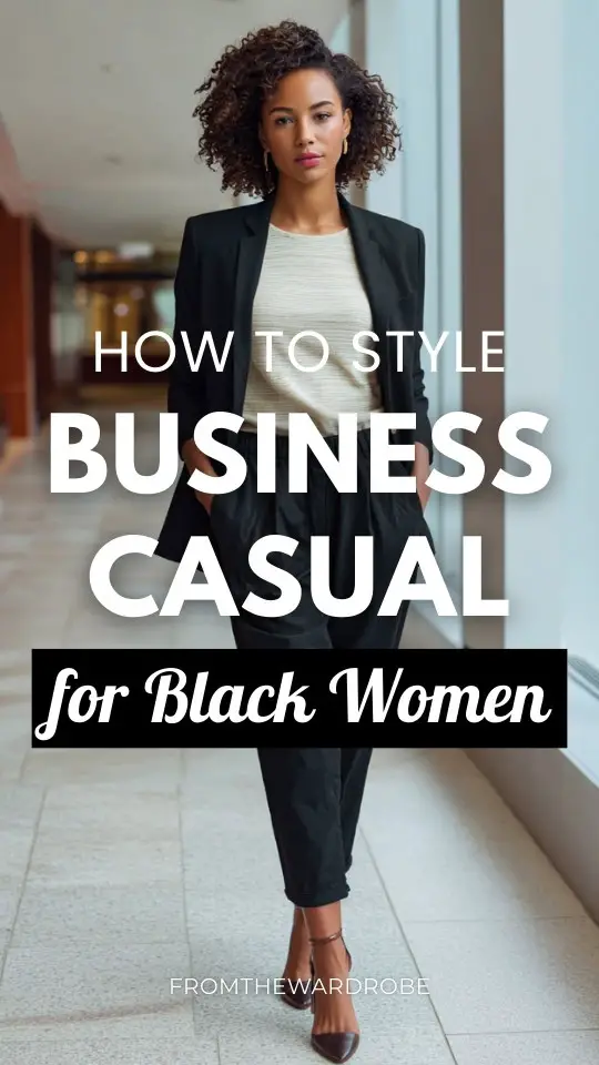a Black woman styled in business casual out with a longline blazer with matching trousers and a refined knit top