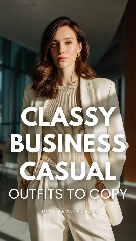 a woman styled in a classy business casual outfit with a longline blazer with matching trousers and a refined knit top