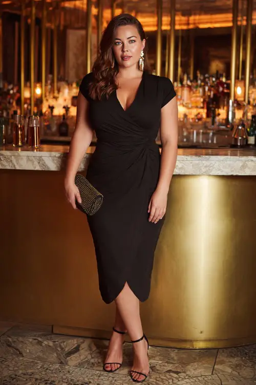 A confident plus-size woman wearing a black wrap midi dress with strappy heels and a structured clutch, soft waves hairstyle and statement earrings