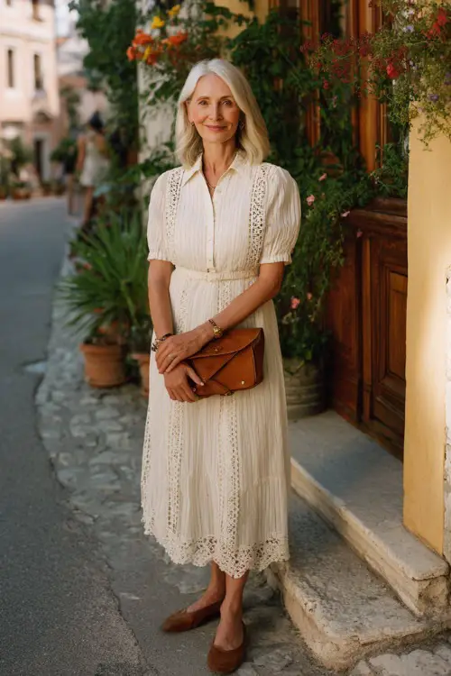 A woman over 50 wears a tailored boho midi dress with delicate embroidery and a flattering silhouette 