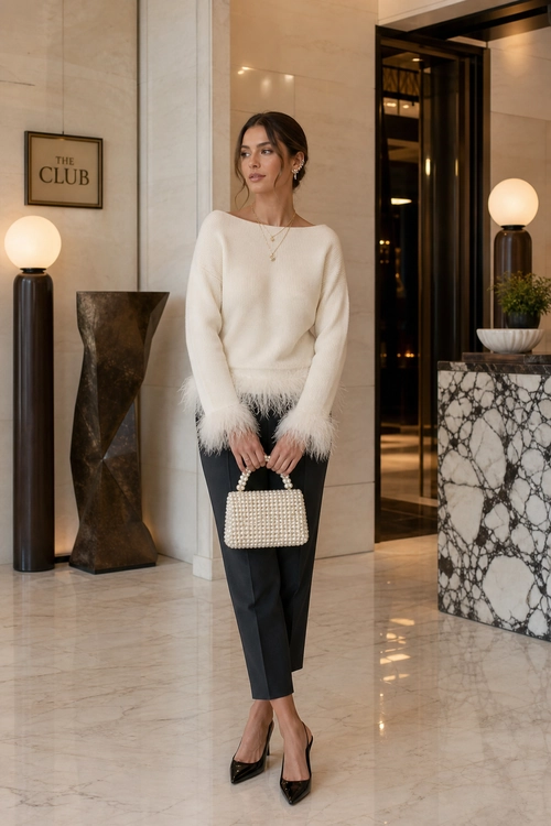 Cream Feather-Trim Sweater and Black Trousers Elegant outfit featuring a cream feather-trimmed sweater, cropped black trousers, pointed black heels, and a pearl-beaded handbag.