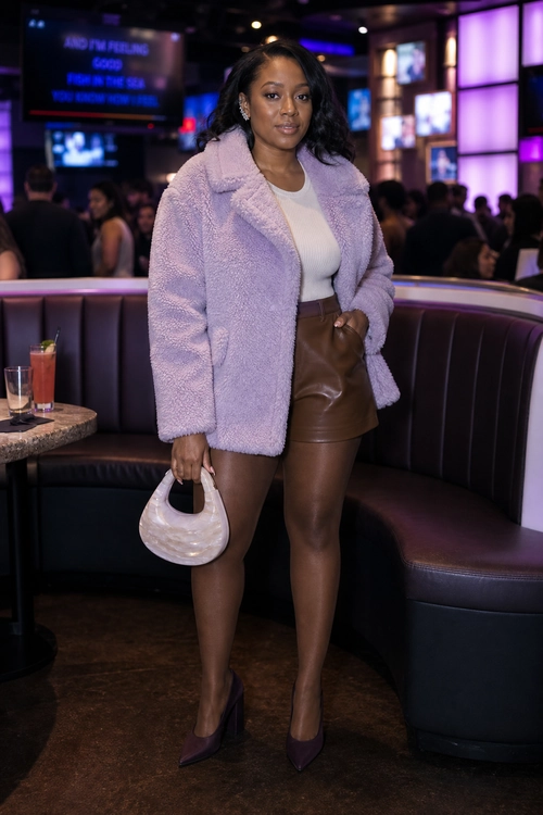 Lavender Plush Coat Outfit A woman wears a lavender plush coat over a white fitted top with a brown leather mini skirt, burgundy pointed pumps, and an ivory crescent handbag.