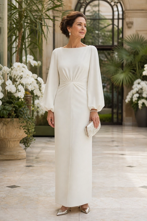 Ivory Ruched-Waist Dress Outfit A woman wearing an ivory long-sleeve dress with a gathered waist, metallic pointed-toe heels, drop earrings, and a small silver clutch.