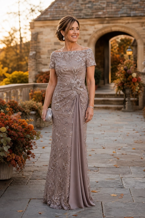 Mauve Embroidered Evening Gown Woman wearing a mauve floor-length embroidered gown with short sleeves, a draped skirt, and a silver clutch.