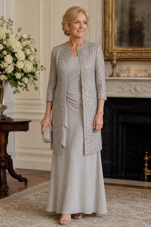 Woman wearing a long silver-gray lace jacket over a matching floor-length dress with a small clutch and open-toe heels.
