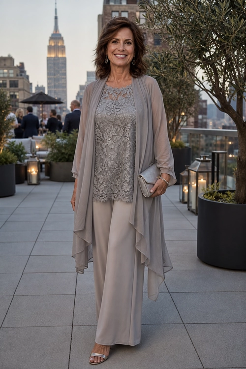 Taupe Lace Layered Evening Look A woman wears a taupe lace top with wide-leg trousers, a flowing sheer cardigan, metallic sandals, and a matching clutch.