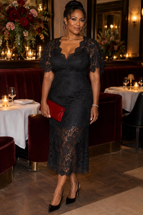 Elegant black lace midi dress styled with black pointed-toe pumps and a red clutch.