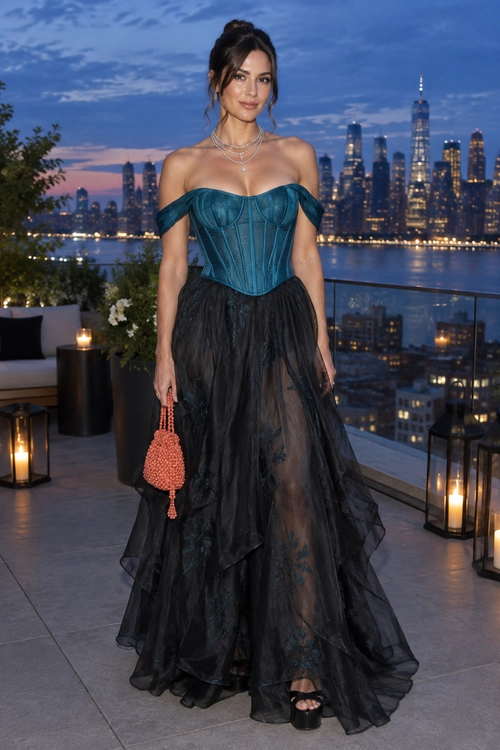 A teal off-the-shoulder corset top paired with a layered sheer black floor-length skirt, black platform sandals, layered necklaces, and a coral beaded clutch.