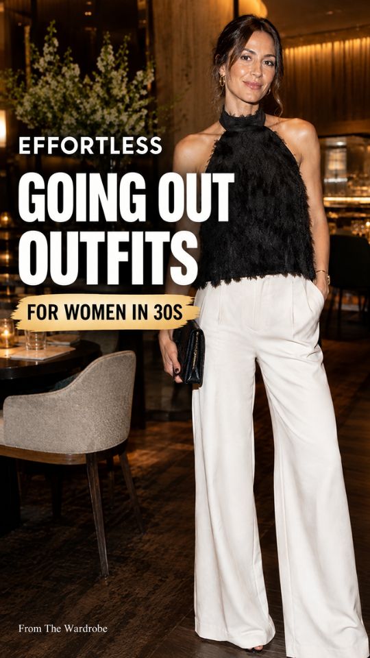 a woman in her 30s wears a going out outfit with a black textured halter top, white wide-leg trousers, gold hoop earrings, and a black clutch